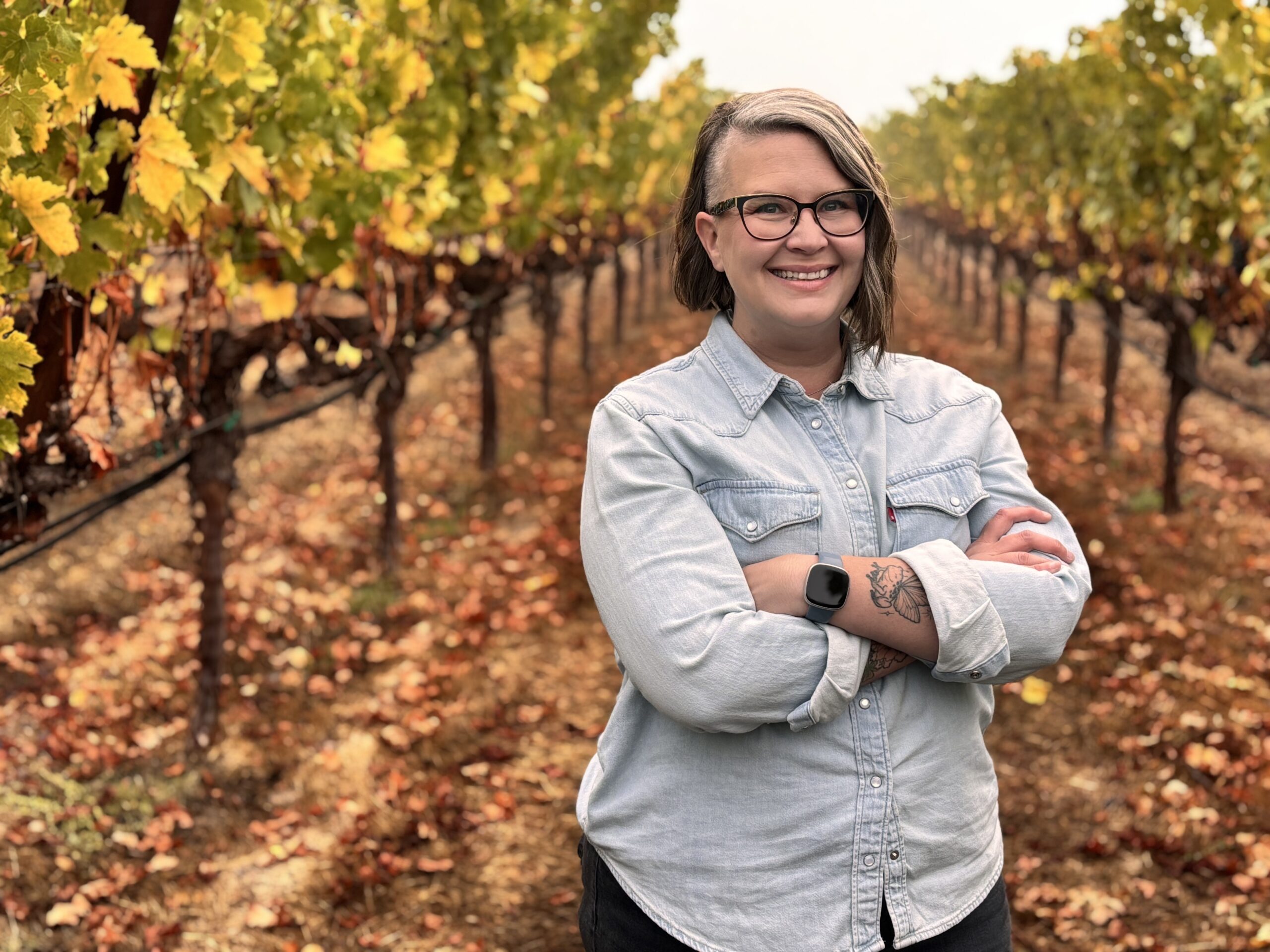 Quattro Theory Winemaker Emily Haines standing among the vineyards