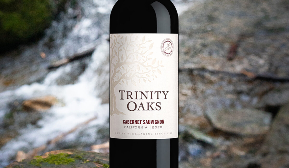 Color image of a bottle of Trinity Oaks Cabernet Sauvignon with a nature background.