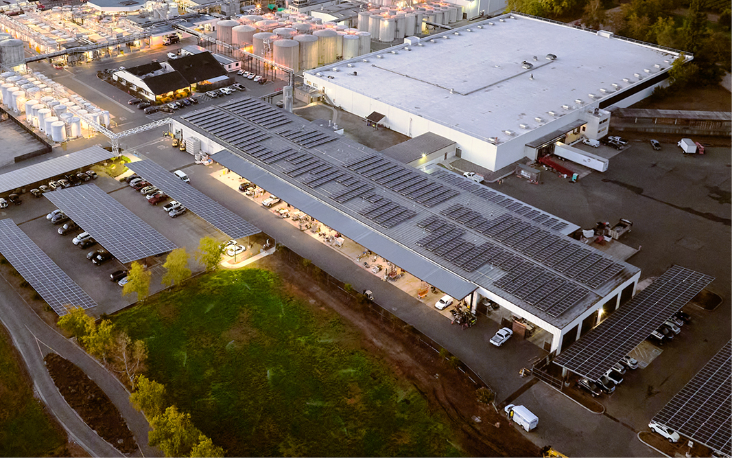 Aerial image of solar panels on a production facility.