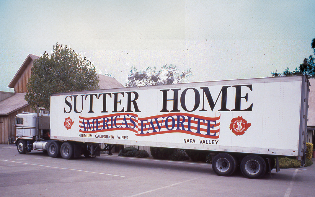 Color image of a big rig semi truck with Sutter Home branded across the side.