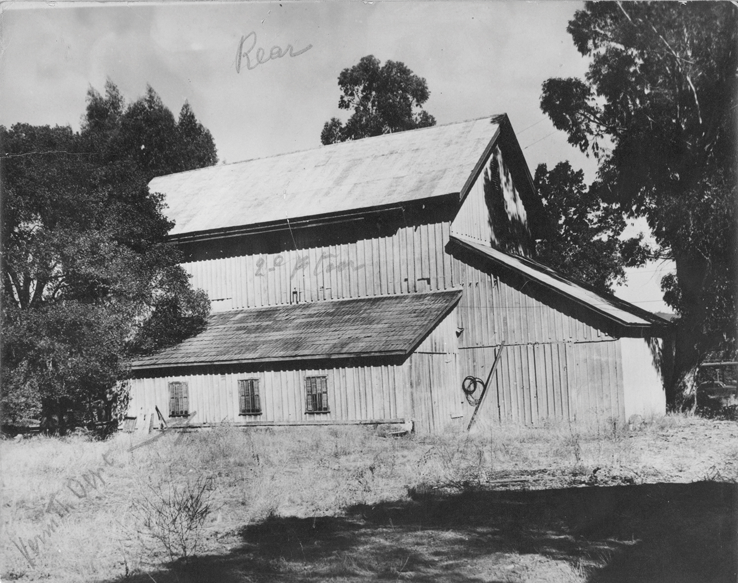 Black and white photo of the original Sutter Home Winery barn in St. Helena, CA.